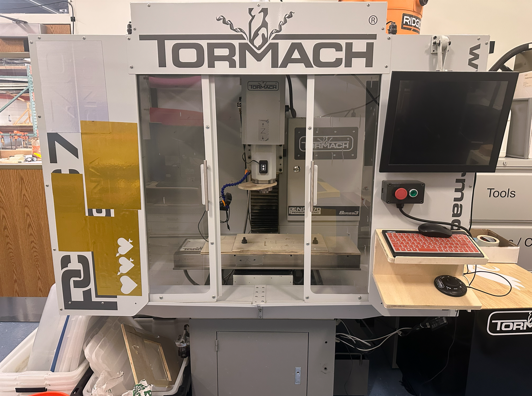 Benchtop milling machine cutting aluminum